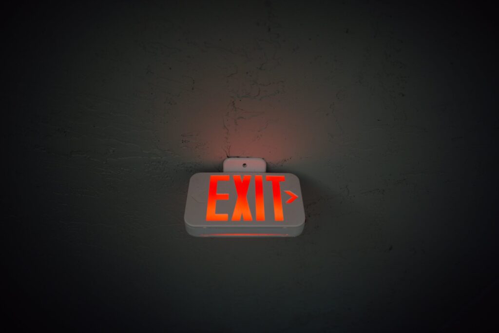 Exit Sign glowing red in reference to making an exit from your Amazon business