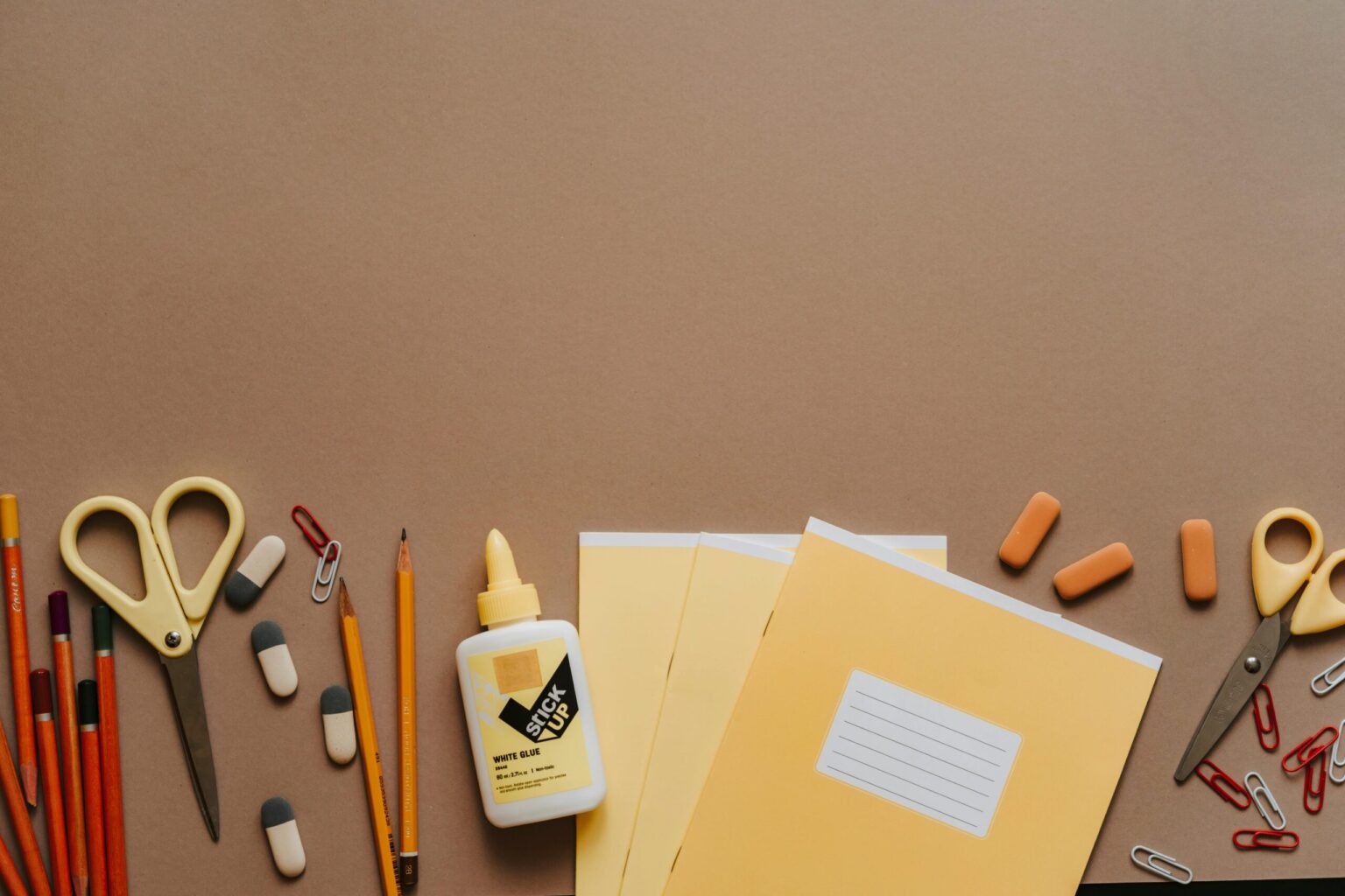 back to school supplies laid out on table in an array